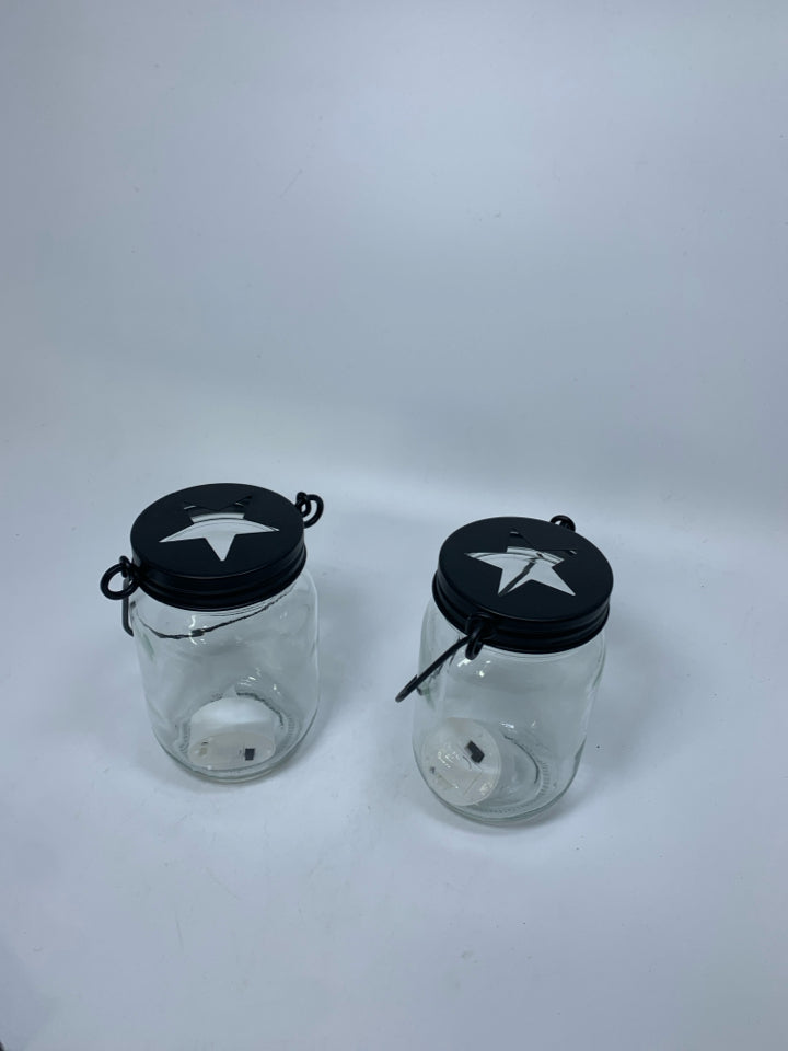 2 GLASS MASON JAYS W/ STAR CUT OUT CAP LANTERN.