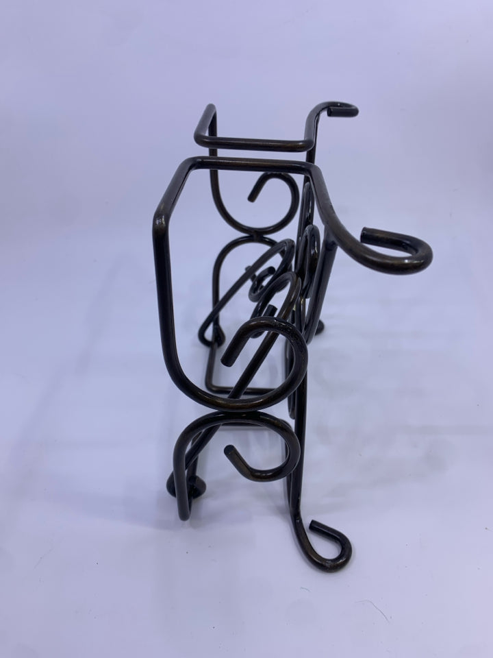 RAISED METAL NAPKIN HOLDER W/ SWIRLED ENDS & LATCH COVER.
