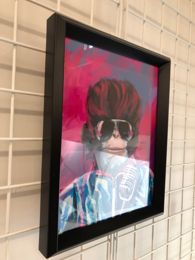 COLORFUL MONKEY IN SUNGLASSES IN BLACK FRAME.