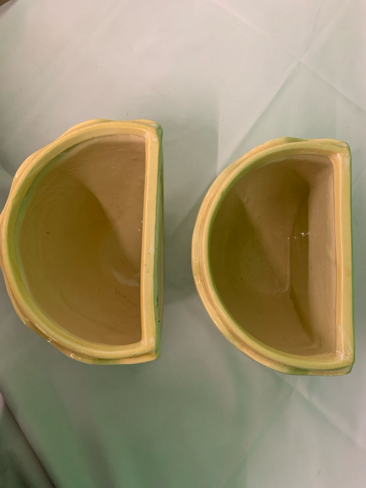2 TAN CERAMIC WALL HANGING PLANTERS.