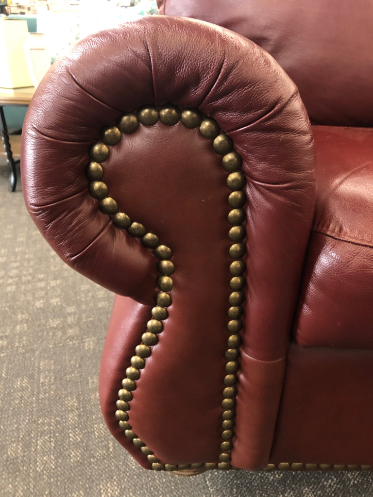 DARK BROWN STUDDED LOVE SEAT.