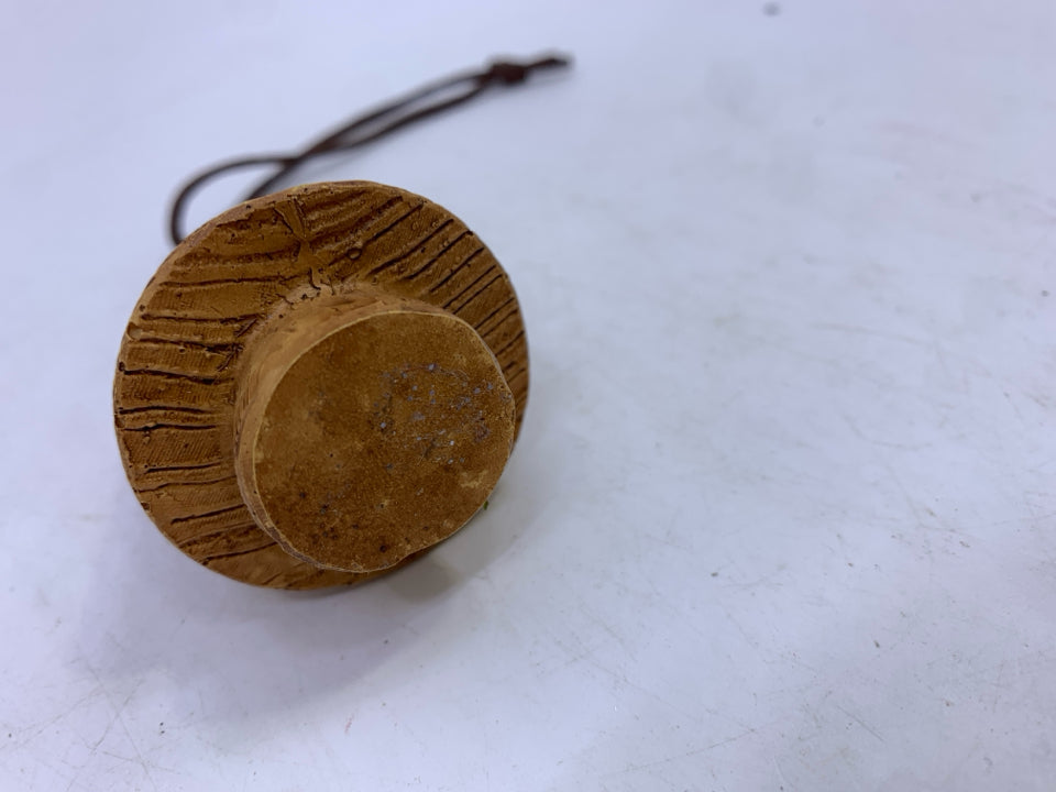 BROWN CERAMIC TREE ORNAMENT.