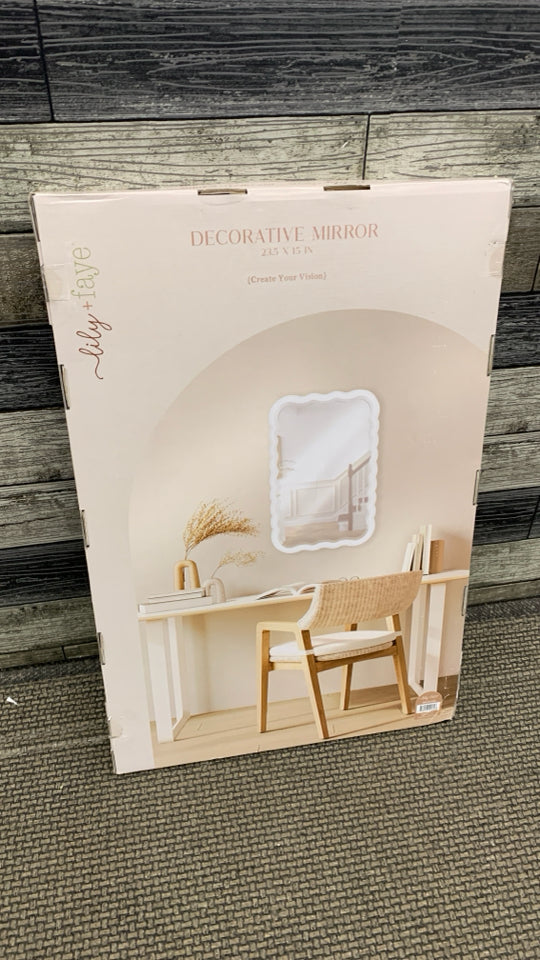 NIB DECORATIVE GOLD/WAVY MIRROR.