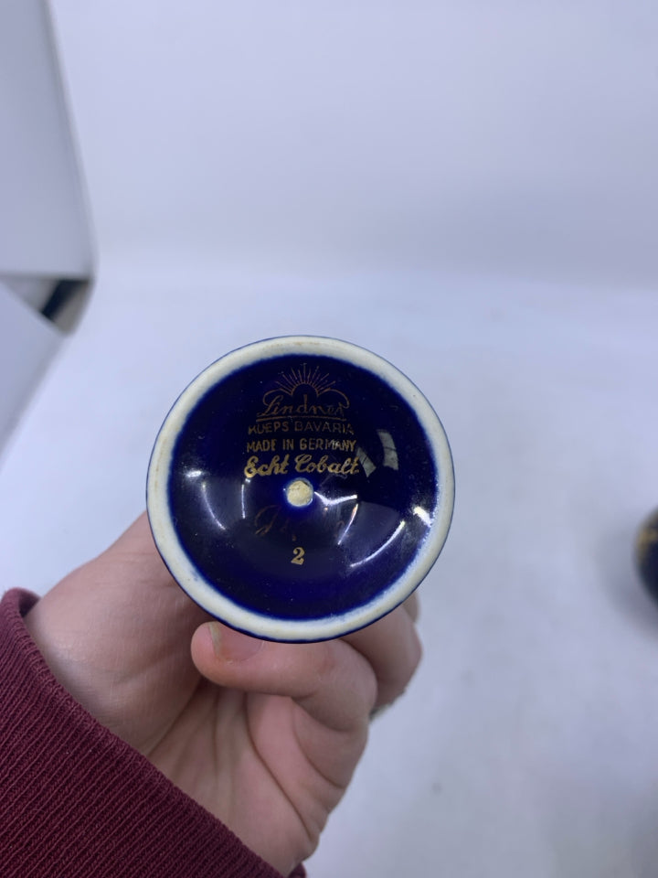 SMALL FOOTED COBALT BLUE VASE W/ GOLD EDGES.