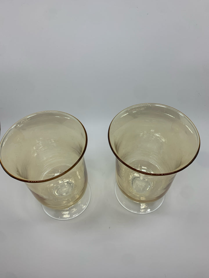 2 AMBER IRIDESCENT FOOTED HURRICANE VASES.