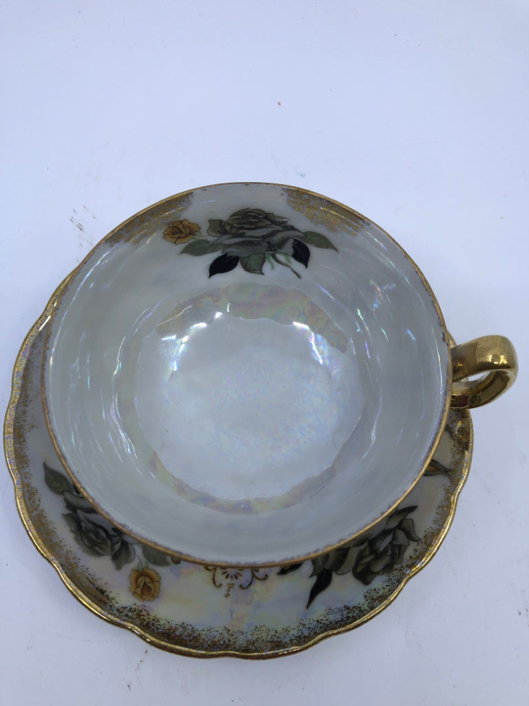 GOLD/GREY IRIDESCENT FLORAL TEACUP AND SAUCER.