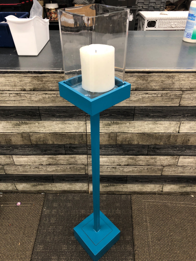 TALL BLUE SQUARE BASE CANDLE HOLDER W/CLEAR GLASS TOP.