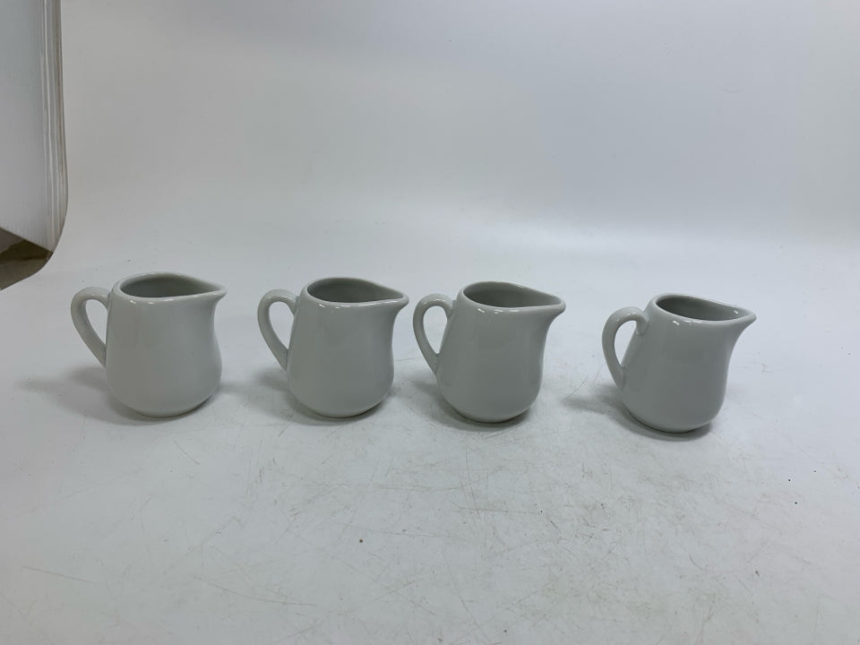 4 MINI WHITE PORCELAIN PERSONAL CREAMERS.