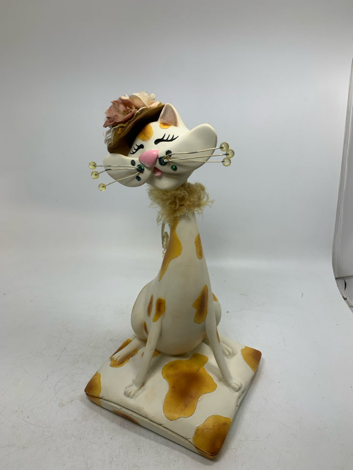 RESIN CREAM/ORANGE CAT W/ HAT/SCARF ON.