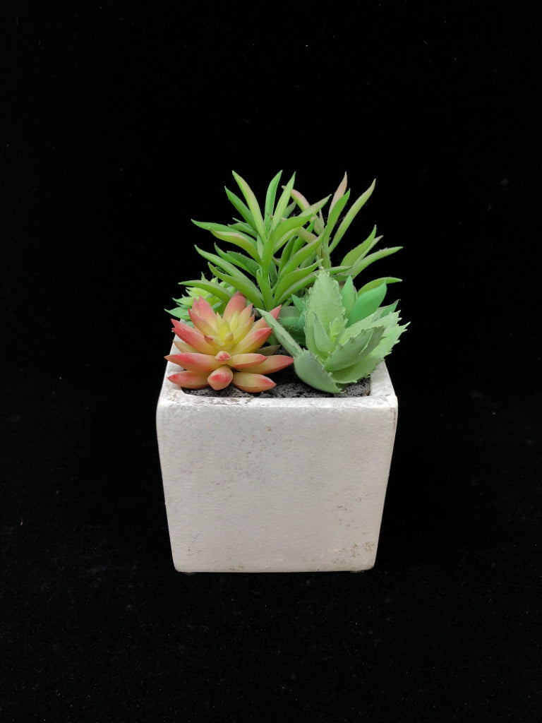 FAUX SUCCULENT IN WHITE CERAMIC BLOCK.