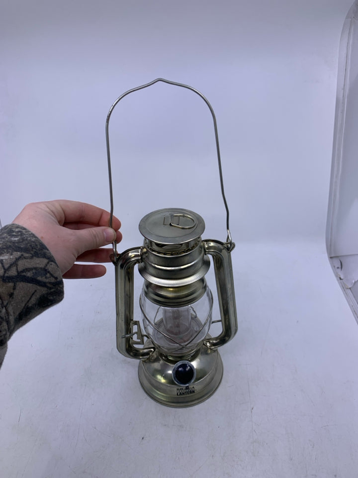 LIGHT WEIGHT SILVER METAL BATTERY POWERS LANTERN.