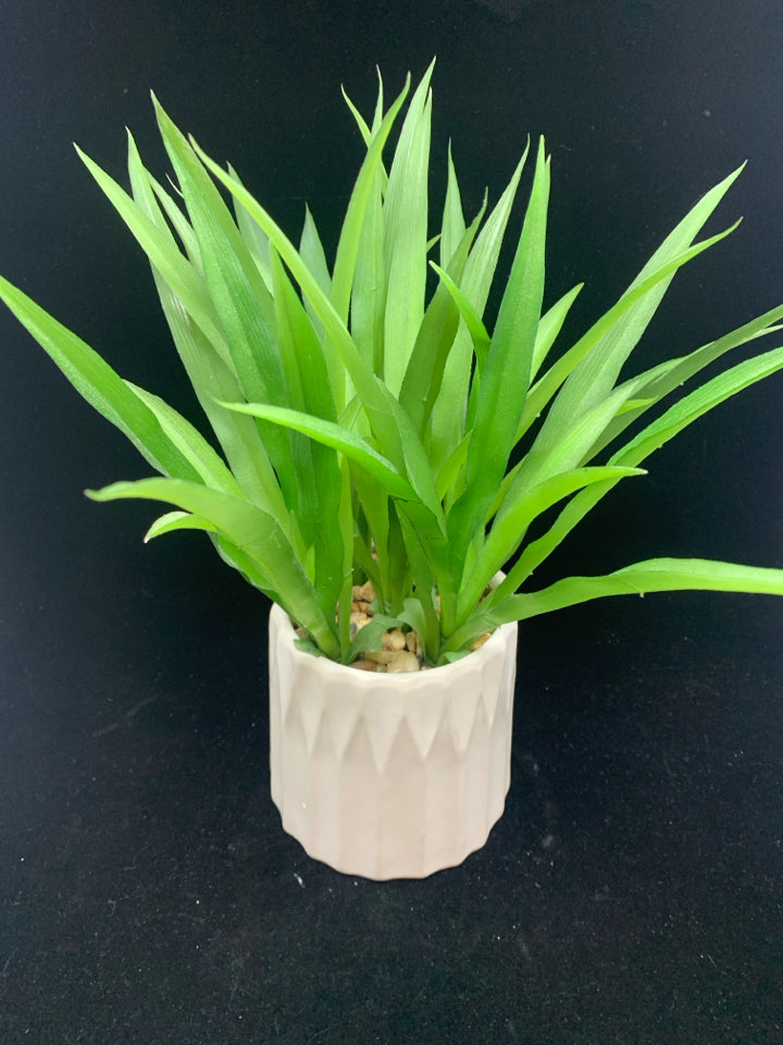 FAUX SUCCULENT IN WHITE POT.