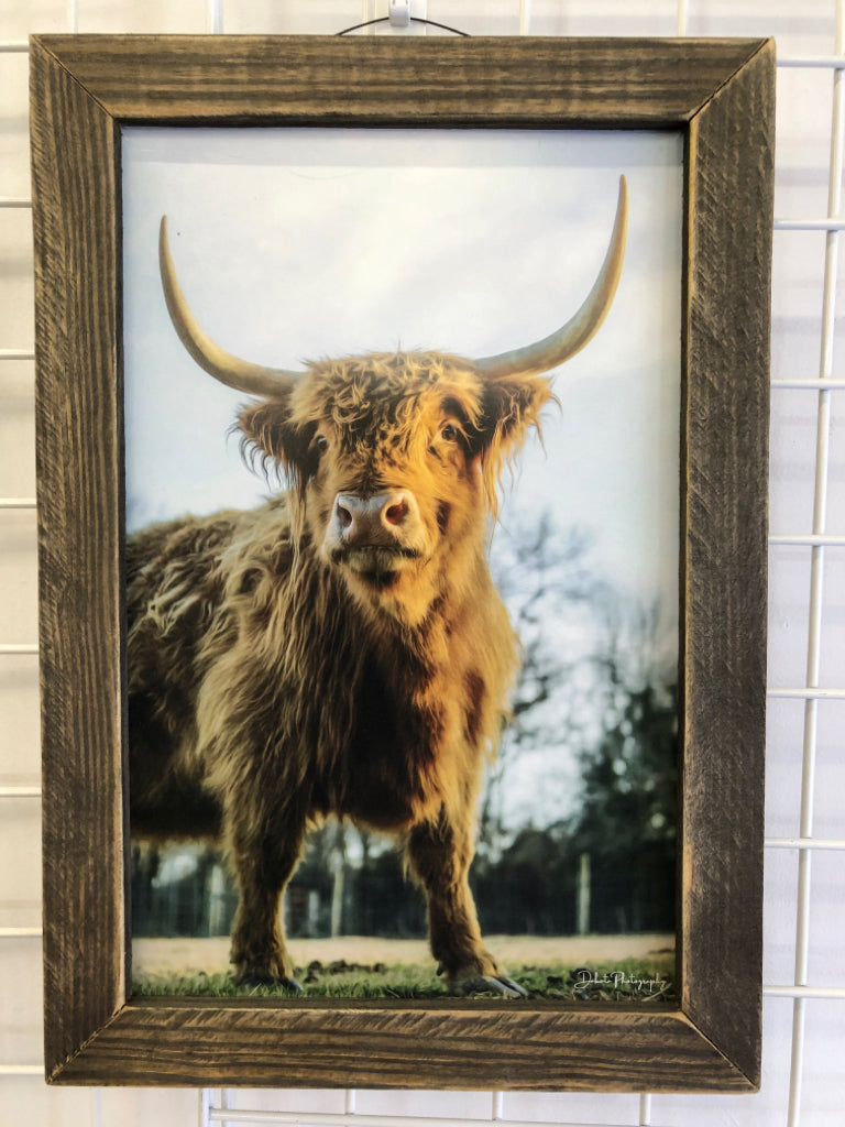 BROWN COW DISTRESSED WOOD FRAME WALL HANGING.