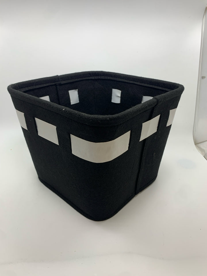 BLACK AND WHITE FELT BASKET WITH BOW.