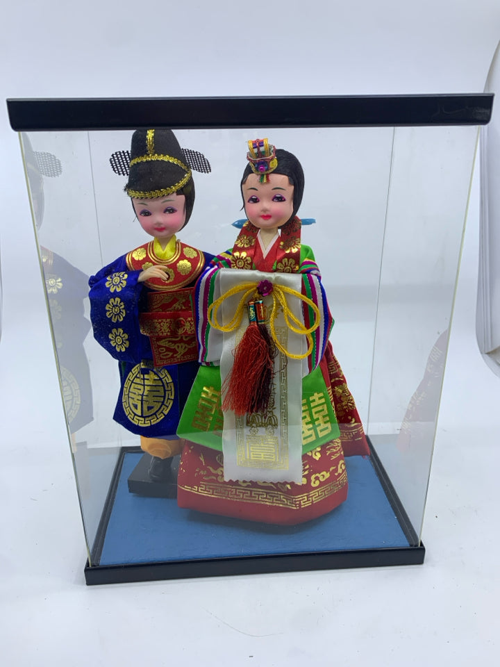 2 ASIAN STYLE DOLLS IN CASE.