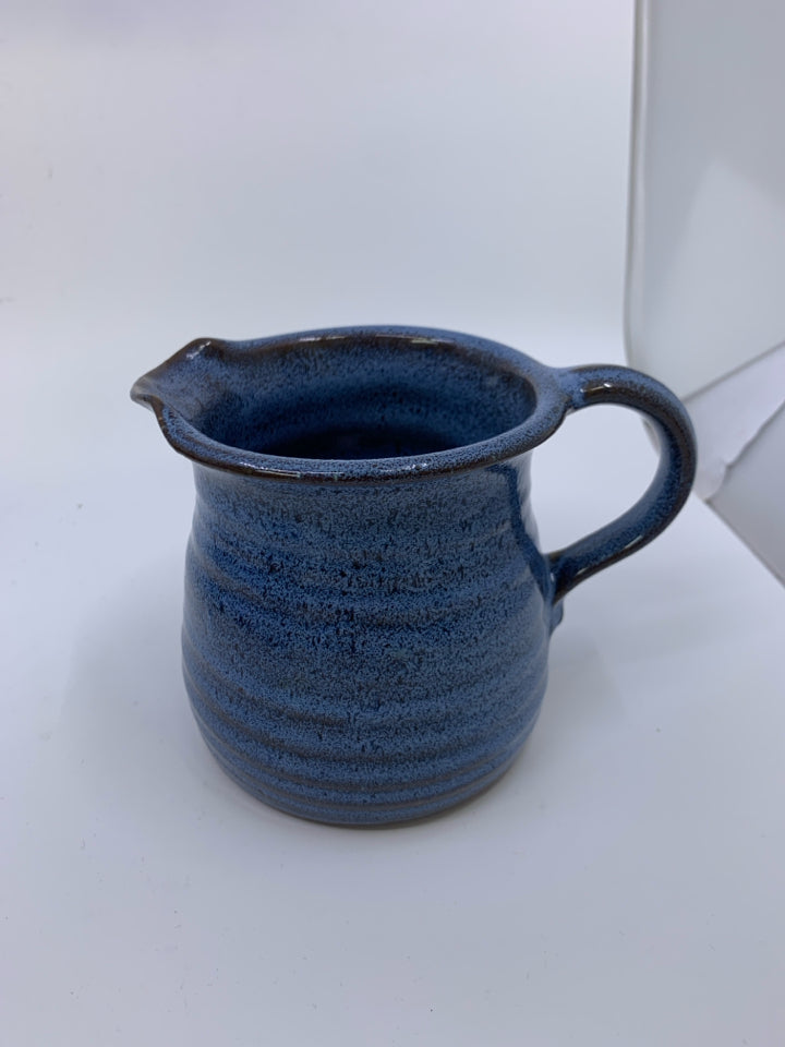 LIGHT BLUE RIBBED POTTERY PITCHER.