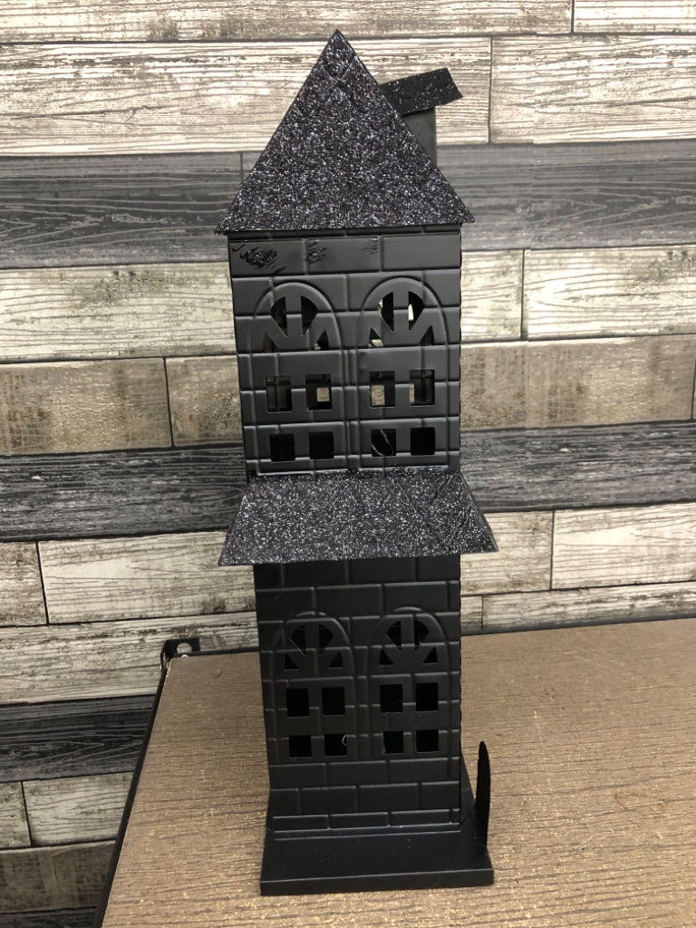 BLACK METAL AND GLITTER LED HAUNTED HOUSE.
