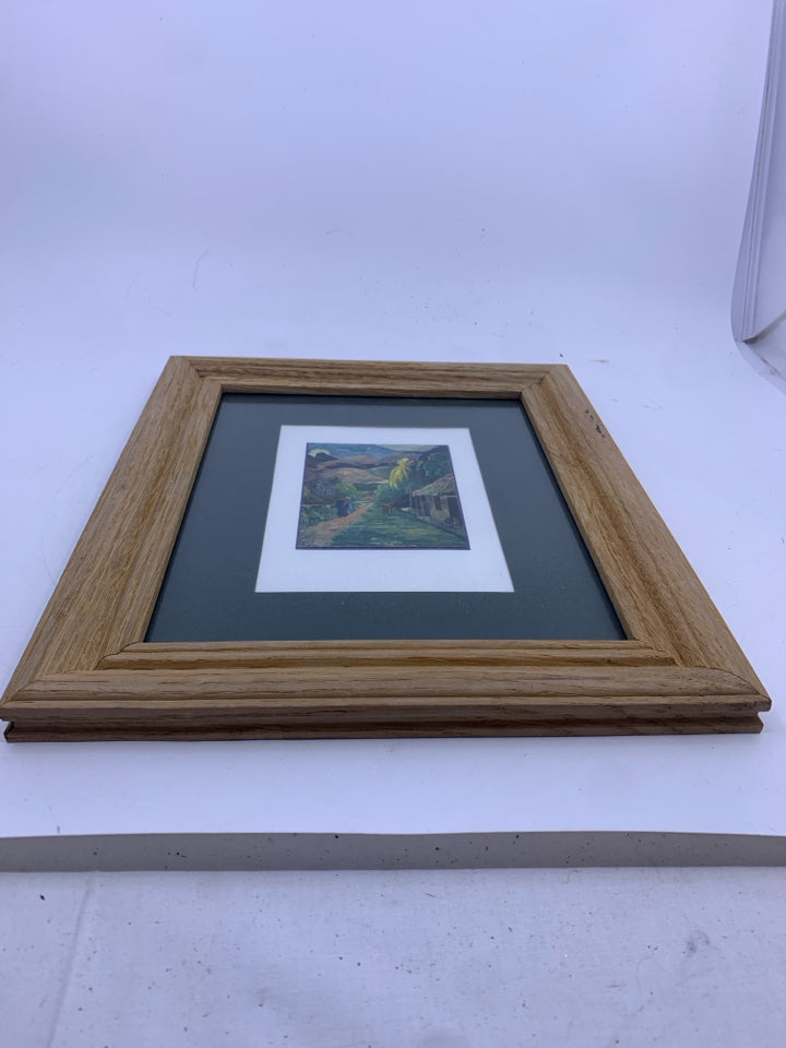 MOUNTIAN SCENE W COUPLE AND CATTLE IN WOOD FRAME WALL ART.