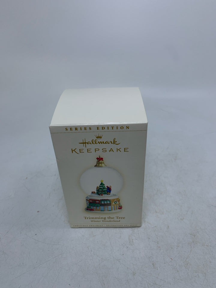 IN BOX TRIMMING THE TREES SNOW GLOBE HALLMARK ORNAMENT.