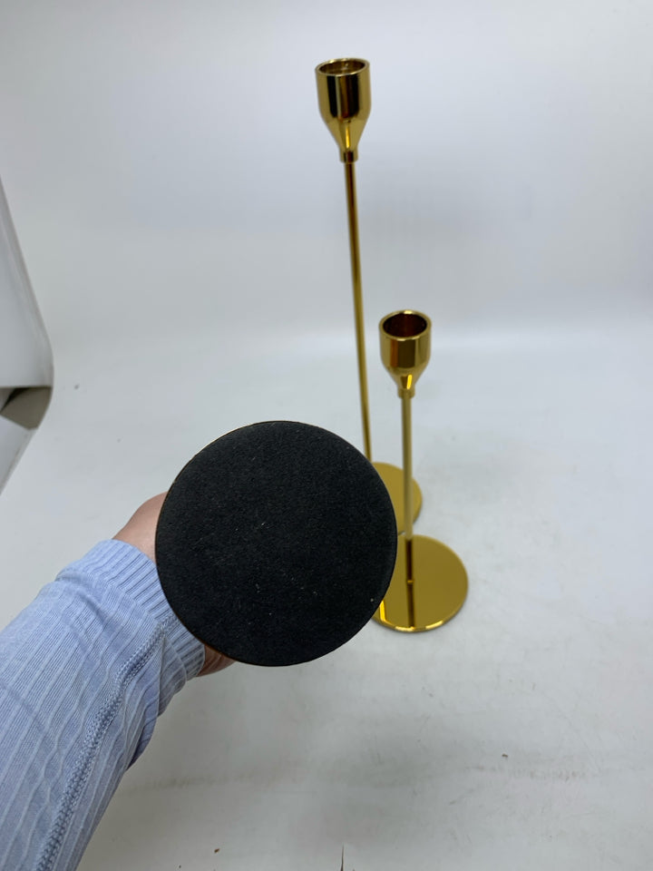 3 GOLD SKINNY TAPERED CANDLE HOLDERS DIFFERENT SIZES.