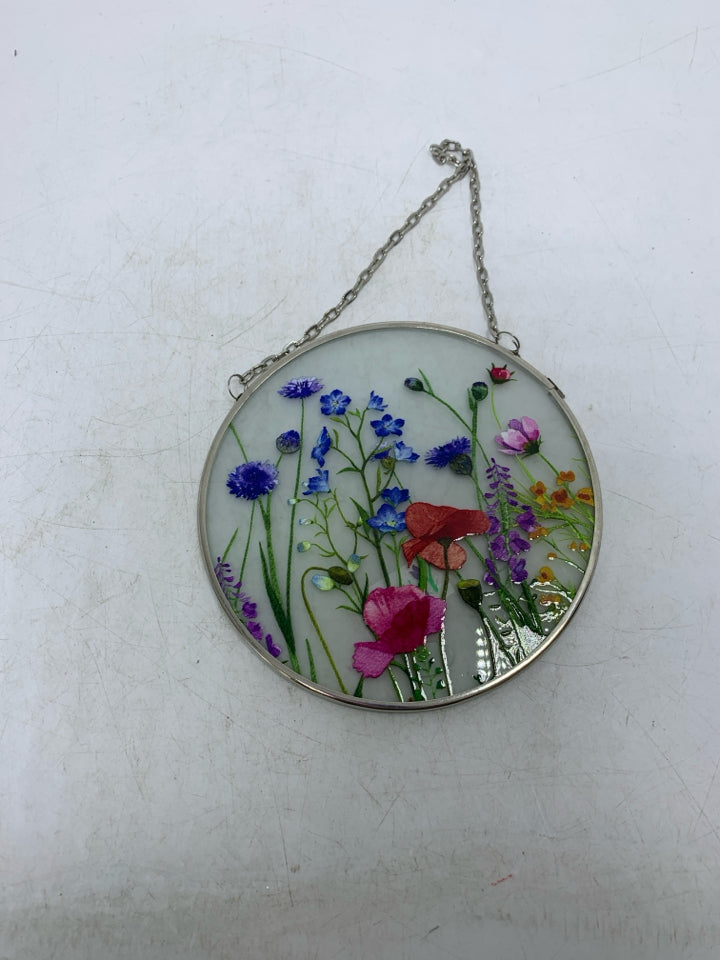 SMALL CIRCLE FROSTED GLASS W/ PRINTED COLORFUL FLOWERS.