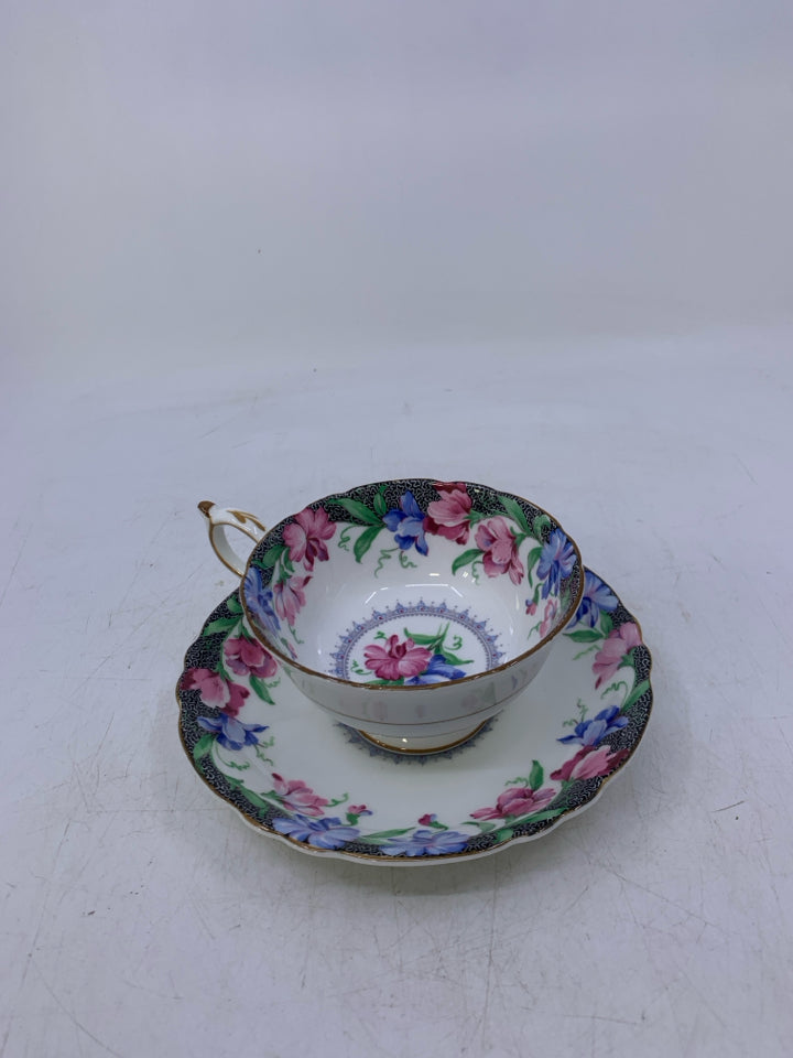 BLUE,PINK FLOWERS W/ BLACK EDGE.