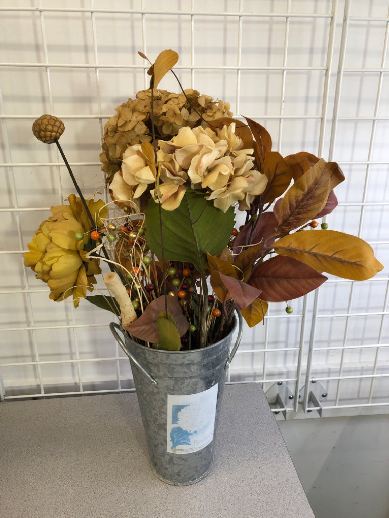 ORANGE & GREEN FAUX FLORALS IN TIN BUCKET.