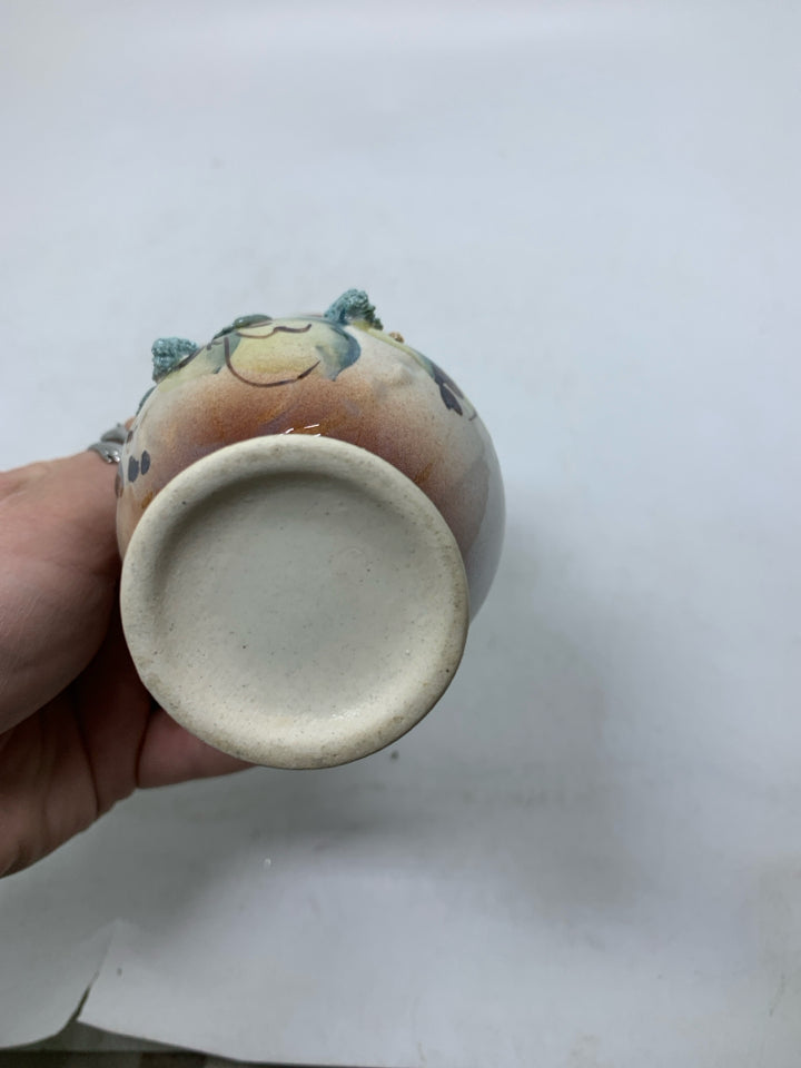 SMALL BROWN VASE W/ EMBOSSED FLOWERS.