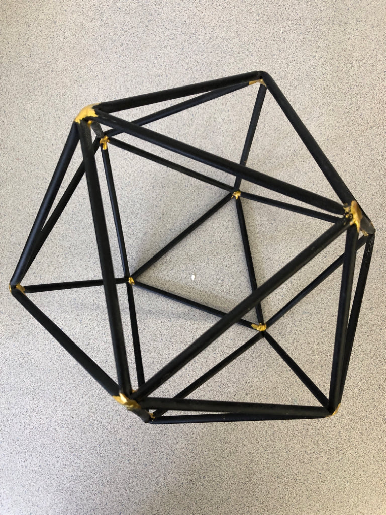 BLACK HEXAGON DECOR W/GOLD POINTS.