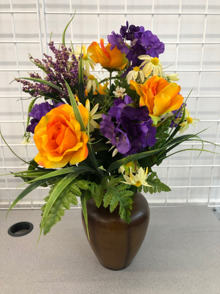 PURPLE/ORANGE FLOWERS IN BROWN VASE.