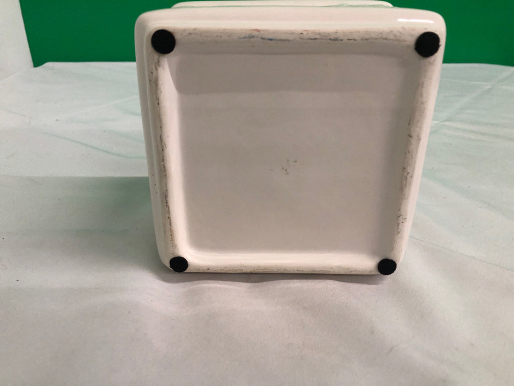 WHITE SQUARE CERAMIC PLANTER W/ EMBOSSED FLOWERS.
