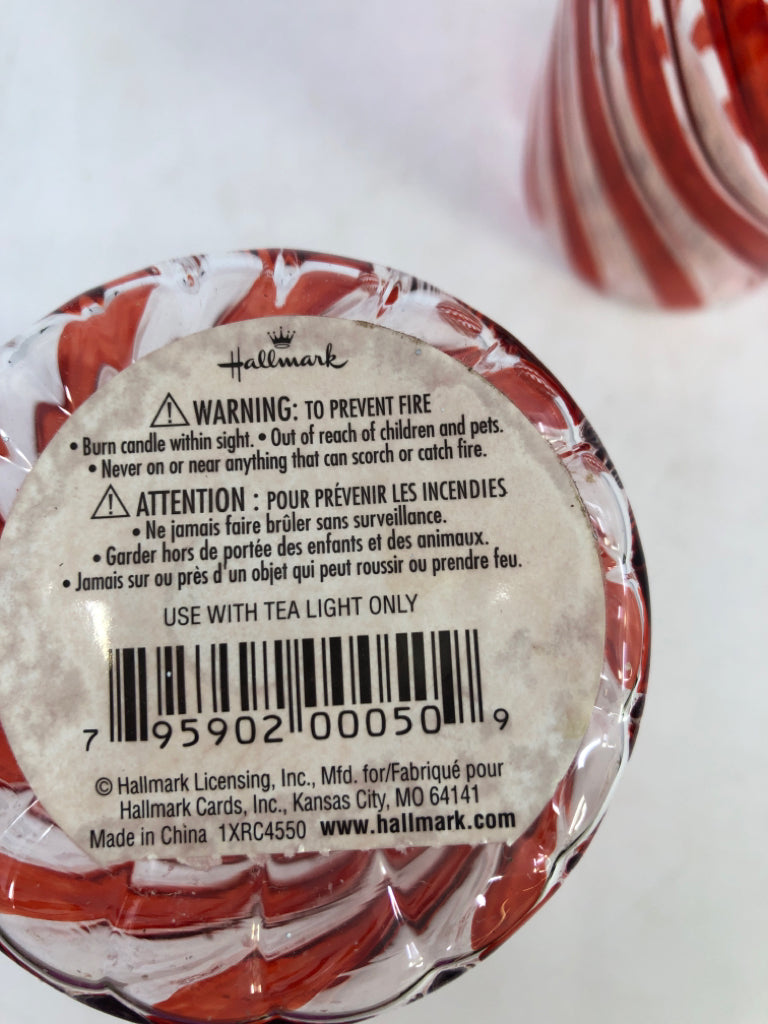 2 GLASS RED SWIRL CANDLE HOLDERS.