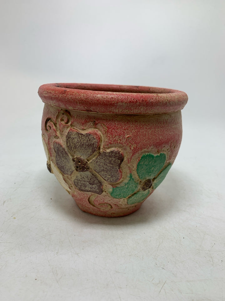 LIGHT WEIGHT PINK PLANTER W/ EMBOSSED COLORFUL FLOWERS.