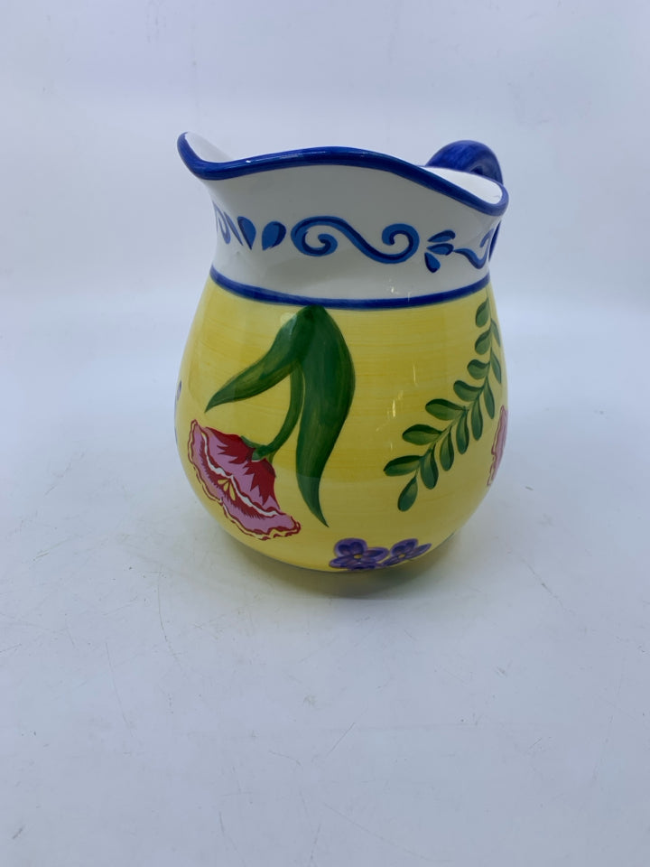 FLORAL BLUE HANDLE CERAMIC PITCHER.