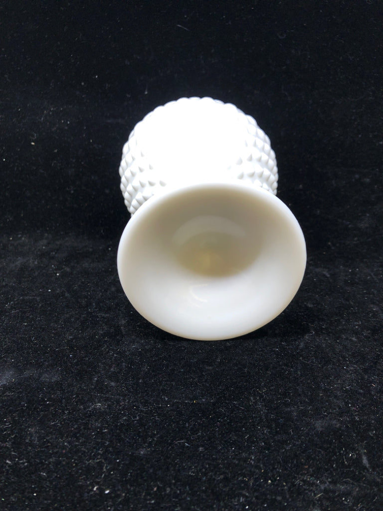 FOOTED MILK GLASS VASE W PINCHED RIM.