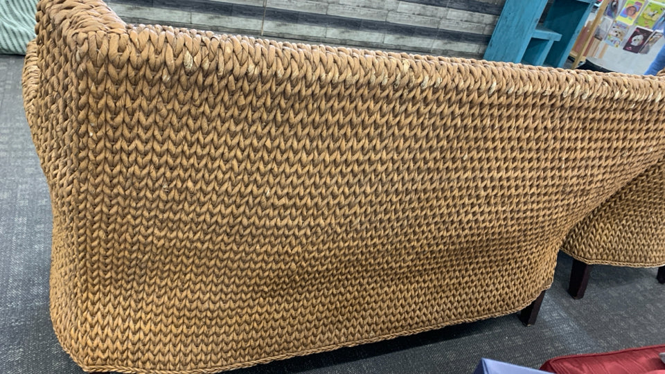 WICKER SOFA W/BROWN CUSHION.