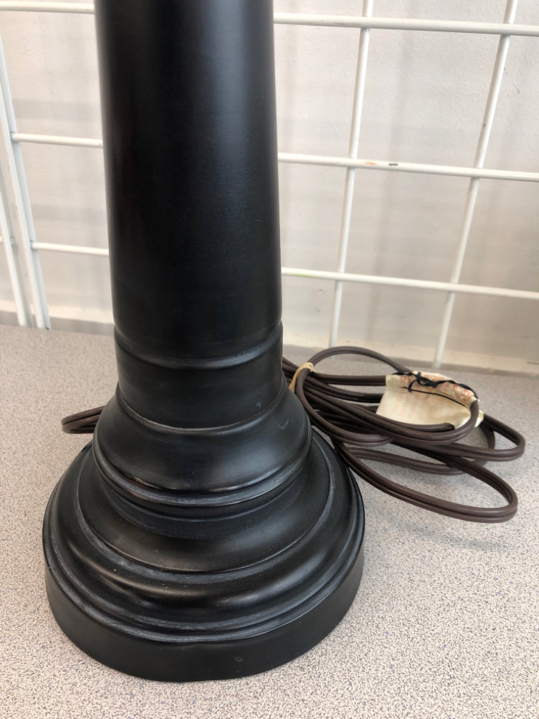 TALL BLACK LAMP W/CREAM FABRIC SHADE.