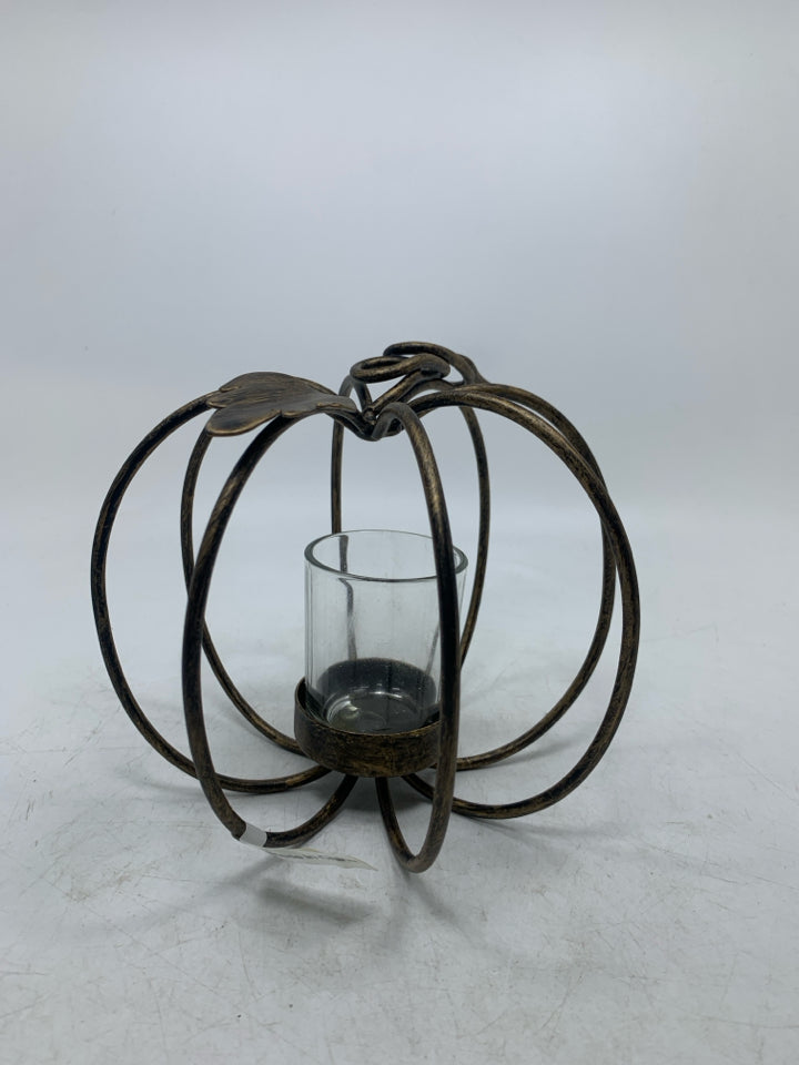 METAL PUMPKIN VOTIVE HOLDER.