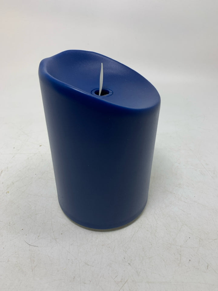 PLASTIC LARGE PILLAR CANDLE W/ BATTERY POWERED LIGHT.