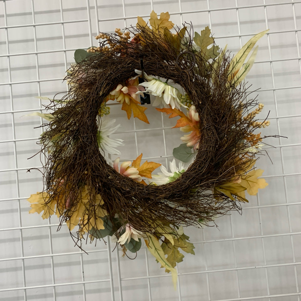 ORANGE/WHITE FAUX FLOWER WREATH.