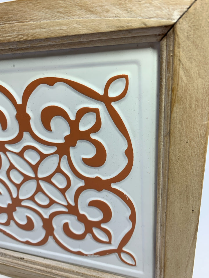 WHITE/PEACH DESIGN METAL TILE IN BLONDE WOOD FRAME.
