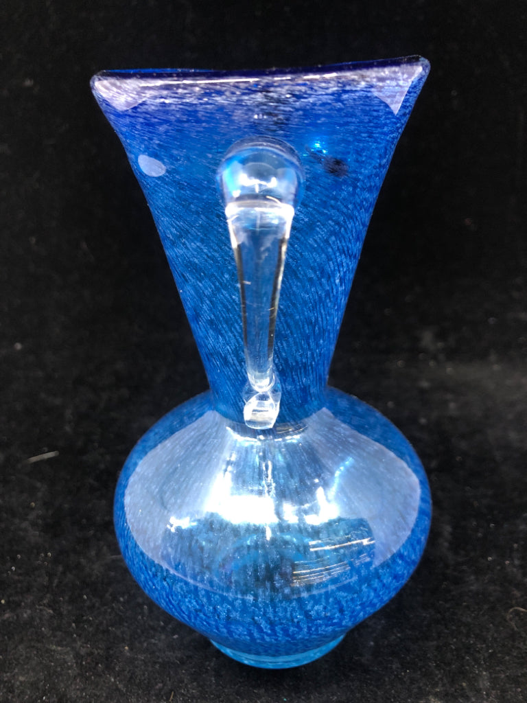 BLUE BLOWN GLASS PITCHER W/ CLEAR GLASS HANDLE.