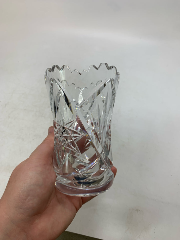 HEAVY BOTTOM STAR PATTERN CRYSTAL VASE W/ UNEVEN TOP.