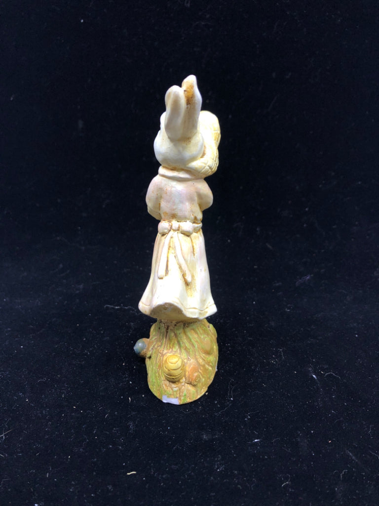 BUNNY HOLDING NET FIGURINE.