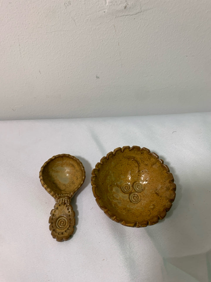 SMALL TAN POTTERY BOWL W SPOON.