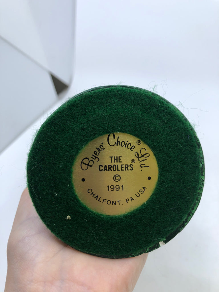 BYERS' CHOICE MAN HOLDING SANTA CARD-1991.