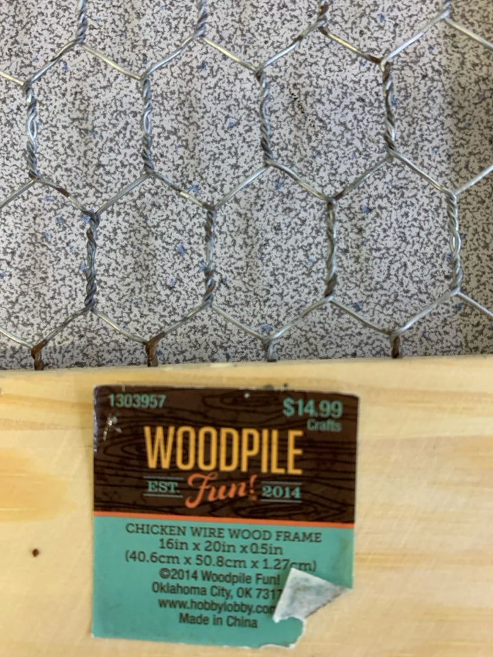 CHICKEN WIRE IN BLONDE WINDOW FRAME.