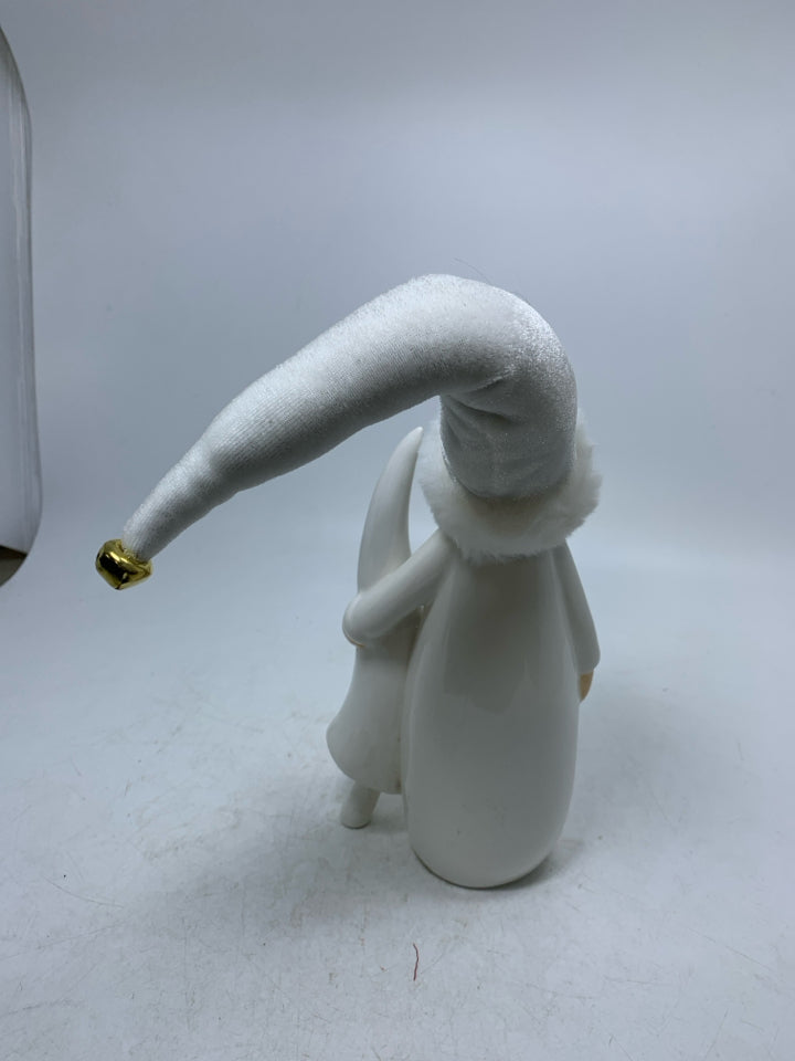 CERAMIC WHITE SANTA HOLDING TREE W/ W/ FABRIC HAT.