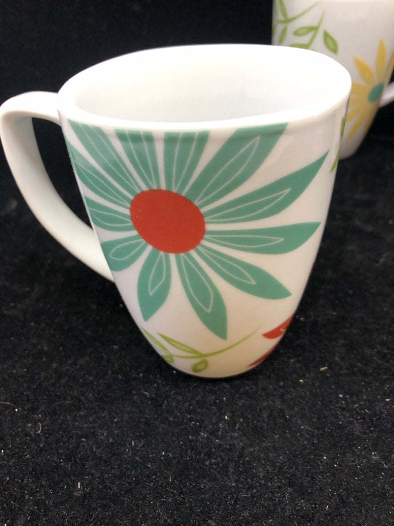 4 FLORAL CORELLE MUGS.