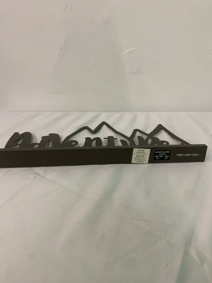 BROWN METAL STANDING ADVENTURE SIGN.
